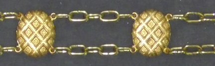 Diamond Shield Plaque Belt Shown with Double Clock-Style Chain Brass