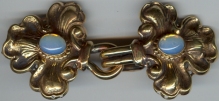 bronze stylized fleur de lis with gem clasp