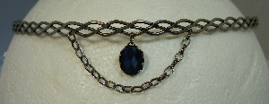 Silver-tone braid band with blue oval dangle and chain