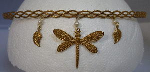 Brass braid with dragonfly and leaves hanging from pearls