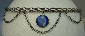 Silver-tone braid band with center blue dangle and chains