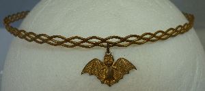 Brass braid with bat dangle