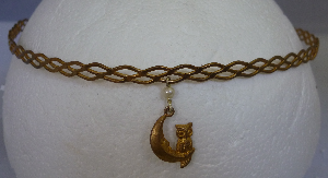 Brass braid with owl and moon dangle