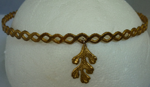 Brass braid with oak leaf dangle