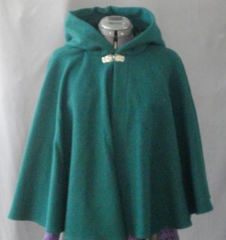 Cloak:1823, Cloak Style:Full Circle Short Cloak, Cloak Color:Forest Green, Fiber / Weave:Washed Wool Flannel, Cloak Clasp:Florentine - Small, Hood Lining:green cotton velvet, Back Length:23.5", Neck Length:21", Seasons:Summer, Fall, Spring.