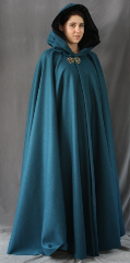 Cloak:1860, Cloak Style:Full Circle Cloak, Cloak Color:Teal/Mallard Blue, Fiber / Weave:Heavyweight 100% Wool Melton with a hard finish, Cloak Clasp:Leaf and Scroll - Patinated, Hood Lining:Black Cotton Velvet, Back Length:55", Neck Length:23", Seasons:Winter, Fall, Spring, Note:This gorgeous mallard blue cloak is made of 100% wool melton <br>with a hard finish, making it only slightly scratchy but more water-resistant. <br>The full-sized hood features a black cotton velvet lining,<br>making it quite an elegant garment. <br>Finished with a lovely handmade Leaf and Scroll hook-and-eye <br>clasp with a patinated finish..