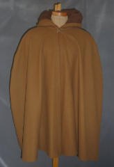 Cloak:1913, Cloak Style:Shaped Shoulder, Cloak Color:Cinnamon Brown, Fiber / Weave:Wool Melton, Cloak Clasp:Double Spiral, Hood Lining:Self-lining, Back Length:35", Neck Length:20", Seasons:Winter, Fall, Spring.