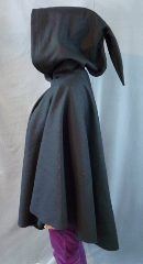 Cloak:1945, Cloak Style:Cape / Ruana with pointed tail hood, Cloak Color:Black, Fiber / Weave:Heavy Wool Melton, Cloak Clasp:Medallion, Hood Lining:Unlined, Back Length:31", Neck Length:23", Seasons:Winter.