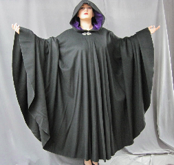 Cloak:1950, Cloak Style:Full Circle Cloak, Cloak Color:Black, Fiber / Weave:Wool / cashmere, Cloak Clasp:Triple Medallion, Hood Lining:Purple Cotton Velveteen, Back Length:54", Neck Length:22", Seasons:Winter, Fall, Spring, Note:This heavy full-circle cloak is made of a luxurious wool/cashmere blend <br>that is soft and warm. Full-sized hood is lined with deep purple cotton velveteen,<br> creating a gorgous contrast. <br>Finished with a pewter Triple Medallion hook-and-eye clasp..