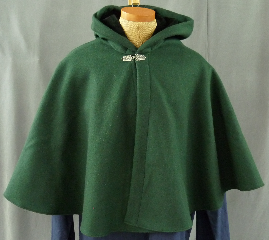 Cloak:1954, Cloak Style:Full Circle Short Cloak, Cloak Color:Forrest Green, Fiber / Weave:Heavy Wool Melton, Cloak Clasp:Florentine - Small, Hood Lining:Black Cotton Velveteen, Back Length:24", Neck Length:21.5", Seasons:Winter, Fall, Spring, Note:This short cloak is a full-circle made of a forest green <br>heavy wool melton and features a full-sized hood lined <br>with black cotton velveteen. <br>Finished with a small pewter Florentine hook-and-eye clasp..