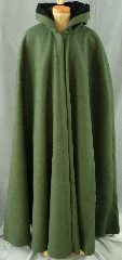 Cloak:1955, Cloak Style:Shaped Shoulder Cloak, Cloak Color:Olive Green, Fiber / Weave:Heavy Felted Wool Melton, Hood Lining:Black Cotton Velveteen, Back Length:58", Neck Length:24", Seasons:Winter, Fall, Spring.