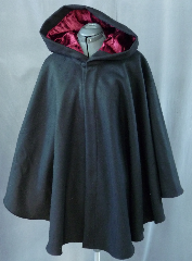 Cloak:1962, Cloak Style:Cape / Ruana, Cloak Color:Black, Fiber / Weave:Heavy Felted Wool Melton, Cloak Clasp:Florentine - Small, Hood Lining:Maroon Polyester longpile Velvet, Back Length:33", Neck Length:23.5", Seasons:Winter, Fall, Spring, Note:This ruana is made of a heavy black felted wool <br>melton. Full-sized hood features a lining of luxurious <br>long-pile polyester Maroon velvet. <br>Finished with a small pewter Florentine hook-and-eye clasp. <br>A cross between a cape and a cloak, a ruana is a great way <br>to keep warm while frequent, unhindered use of your arms <br>is needed. Ruanas make great driving cloaks!.