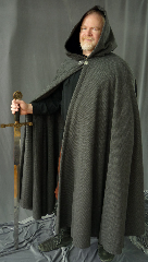 Cloak:1988, Cloak Style:Full Circle Cloak, Cloak Color:Plaid, Fiber / Weave:100% Lambswool, Cloak Clasp:Nordic Block, Hood Lining:Black Silk Velvet, Back Length:51", Neck Length:23", Seasons:Southern Winter, Fall, Spring, Note:Extraordinarily soft, lambswool is the utmost in elegance and luxury. <br>This cloak is made of 100% lambswool woven into a lovely dark mini plaid. <br>Features a full hood lined with black silk velvet for even more luxury. Finished off with a Nordic Block hook-and-eye clasp. <br>This drapey, elegant fabric is not as windproof as some, but still cuddly and soft..