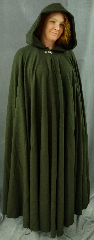 Cloak:1991, Cloak Style:Full Circle Cloak, Cloak Color:Green Jacquard, Fiber / Weave:Worsted Wool, Cloak Clasp:Dragon Knot, Hood Lining:Black Moleskin, Back Length:59", Neck Length:21", Seasons:Spring, Fall, Summer.