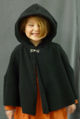 Cloak:1998, Cloak Style:Shaped Shoulder - Short (Youth), Cloak Color:Black, Fiber / Weave:WindPro Fleece, Cloak Clasp:Plain Rope<br>Hook & Eye, Hood Lining:Self-lining, Back Length:17", Neck Length:16", Seasons:Winter, Fall, Spring, Note:This is a short shaped shoulder cloak,<br>recommended for youngsters, about size 3T.<br>Features a small, unlined hood.<br>Made of WindPro Fleece, which is 60-70%<br> windproof and has a water-resistant finish.<br>Closes with a Plain Rope hook-and-eye clasp..