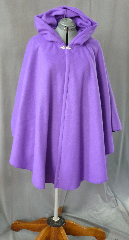 Cloak:2022, Cloak Style:Ruana, Cloak Color:Vibrant Grape Purple, Fiber / Weave:Polyester Fleece, Cloak Clasp:Fleur de Lis, Hood Lining:Unlined, Back Length:37", Neck Length:23", Seasons:Spring, Fall, Note:A great way to keep warm in the spring and autumn months,<br> this polyester fleece ruana is a striking vibrant<br> grape purple. Features a full hood and closes with a<br> Fleur de Lis hook-and-eye clasp..