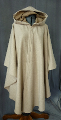 Cloak:2028, Cloak Style:Cape / Ruana, Cloak Color:Natural, Fiber / Weave:Wool, Cloak Clasp:Bavarian - Bronzetone, Hood Lining:Tan moleskin, Back Length:46", Neck Length:22.5", Seasons:Spring, Fall, Winter, Note:A simple, natural colored wool with a complimenting tan moleskin lined full hood. Finished with a bronze-tone Bavarian hook-and-eye clasp. <br>A cross between a cape and a cloak, a ruana is a great way <br>to keep warm while frequent, unhindered use of your arms <br>is needed. Ruanas make great driving cloaks!.