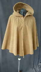 Cloak:2029, Cloak Style:Full Circle Short Cloak, Cloak Color:Golden Tan, Fiber / Weave:Windblock Polar Fleece, Cloak Clasp:Vale - Goldtone, Hood Lining:Self-lining, Back Length:29", Neck Length:22.5", Seasons:Winter, Fall, Spring, Note:This short golden tan full circle cloak is made of  WindBloc Polar fleece, which is 100% wind resistant,<br> and has a water-repelling outer finish! It's perfect<br>for New England winters and cold, rainy, windy climates.<br>The inside of the fabric absorbs moisture making it great for outdoor exercise. <br>Machine washable cold gentle, tumble dry low ONCE<br>with the inside out, allow to air-dry the rest of the way..