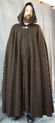 Cloak:2312, Cloak Style:Full Circle Cloak, Cloak Color:Brown, Fiber / Weave:100% Wool, Cloak Clasp:Triple Medallion, Hood Lining:Unlined, Back Length:56", Neck Length:25", Seasons:Winter, Fall, Spring, Note:This dark brown cloak is made of 100% wool<br>basket weave fabric woven from chunky yarns.<br>The brown is slightly heathered with gray. The generous full hood<br>is unlined, making it great for early period re-enactment.<br>Finished with a pewter triple medallion clasp that is safe to dry clean..