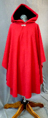 Cloak:2130, Cloak Style:Cape / Ruana, Cloak Color:Red, Fiber / Weave:Wool Melton, Cloak Clasp:Tree of Life, Hood Lining:Black Cotton Velveteen, Back Length:45", Neck Length:22", Seasons:Winter, Fall, Spring, Note:This crimson red cape is as plush and warm as it looks!<br>The black silk velvet in the full size hood lends drama and elegance.<br> It is closed by a pewter Tree of Life clasp.<br>A cross between a cape and a cloak, a ruana is a great way <br>to keep warm while frequent, unhindered use of your arms <br>is needed. Ruanas make great driving cloaks!.