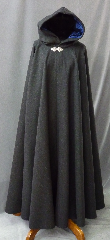 Cloak:2214, Cloak Style:Full Circle Cloak, Cloak Color:Charcoal Grey, Fiber / Weave:80% Wool/ 20% Nylon Double Twill, Cloak Clasp:Triple Medallion, Hood Lining:Deep Rich Blue Long Pile Velvet, Back Length:56", Neck Length:23", Seasons:Winter, Fall, Spring.