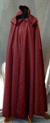 Cloak:2358, Cloak Style:Full Circle Cloak, Cloak Color:Deep Cranberry, Fiber / Weave:Light weight wool suiting, Cloak Clasp:Vale, Hood Lining:Unlined, Back Length:57.5", Neck Length:22.5", Seasons:Summer, Fall, Spring, Note:This light weight wool suiting<br>full circle cloak is a deep cranberry color.<br>The unlined full size hood has just the<br>right amount of drape for a romantic look.<br>Dry Clean only..