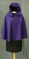 Cloak:2415, Cloak Style:Full Circle Short Cloak, Cloak Color:Vibrant Royal Purple, Fiber / Weave:Light Weight Wool Tricotene, Cloak Clasp:Alpine Knot - Silvertone, Hood Lining:Unlined, Back Length:18", Neck Length:18.5", Seasons:Summer, Spring, Fall, Note:This vibrant royal purple short full circle cloak<br>was created from a suiting fabric. The cloak<br>drapes beautifully, flows well, is wrinkle resistant<br>and provides warmth and wind resistance<br>suitable for cool spring and summer evenings..