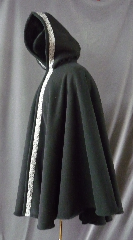 Cloak:2423, Cloak Style:Cape / Ruana Cloak with Knotworks Black Trim, Cloak Color:Black, Fiber / Weave:Ripstop WindPro Sherling Fleece, Cloak Clasp:Plain Rope<br>Hook & Eye, Hood Lining:Self-lining, Back Length:36", Neck Length:24", Seasons:Winter, Fall, Spring, Note:Luxurious, functional, and economically friendly!<br>This windpro cloak blocks more wind than a basic fleece<br>and has a water repelling outer finish!It's perfect<br>for New England winters and cold, rainy, windy climates.<br>The inside of the fabric wicks up moisture keeping you dry and warm.<br>Trimmed with a classic black & silver Knotworks trim.<br>Machine washable cold gentle, tumble dry low<br>Throw it on and go!.