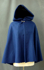 Cloak:2425, Cloak Style:Multi-panel semi circle, Cloak Color:Bright Navy Blue, Fiber / Weave:Heavy Wool Melton, Cloak Clasp:Plain Rope<br>Hook & Eye, Hood Lining:Unlined, Back Length:31", Neck Length:22", Seasons:Winter, Fall, Spring, Note:This bright navy blue short cloak is made from a<br>heavy wool melton, and features a full hood.<br>Sturdy and durable, this cloak will stand up to winter<br>weather with some wind resistance.  Dry Clean only..