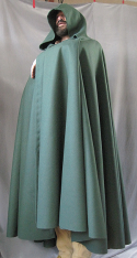 Cloak:2558, Cloak Style:Full Circle Cloak, Cloak Color:Hunter Green, Fiber / Weave:Wool Melton, Cloak Clasp:Triple Medallion, Hood Lining:Unlined, Back Length:54", Neck Length:26", Seasons:Fall, Winter, Spring.