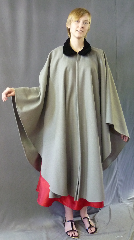 Cloak:2623, Cloak Style:Cape / Ruana with Black Velvet Collar, longer over the shoulder, Cloak Color:Banker Grey, Fiber / Weave:Heavyweight 100% wool melton, felted, Cloak Clasp:Plain Rope<br>Hook & Eye, Hood Lining:N/A, Back Length:48", Neck Length:21", Seasons:Winter, Fall, Spring, Note:A cross between a cape and a cloak,<br>a ruana is a great way to keep warm when<br>frequent, unhindered use of your arms is needed.<br>Made in a very neutral dove gray,<br>this cloak is made from a felted wool thick<br>enough to have some  wind and water resistance.<br>Black Velvet collar adds elegance.<br>Sturdy and durable, this cloak will stand up to<br> winter weather. Dry Clean only..