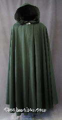 Cloak:2797, Cloak Style:Full Circle Cloak, Cloak Color:Dark Green, Fiber / Weave:100% Polyester, Cloak Clasp:Vale, Hood Lining:Unlined, Back Length:53", Neck Length:21", Seasons:Fall, Spring, Note:This light to midweight dusty green cloak<br>has a soft microfiber outer texture<br>and enough weight for a<br>dramatic swoosh and drape as<br>you make an entrance or exit.<br>Perfect for cool evenings<br>and tightly woven enough for a<br>little wind protection.<br>Accented with a Silvertone Vale<br>hook-and-eye clasp..
