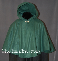 Cloak:2828, Cloak Style:Full Circle Short Cloak, Cloak Color:Forest Green, Fiber / Weave:Polyester Economy Fleece, Cloak Clasp:Alpine Knot - Goldtone, Hood Lining:Unlined, Back Length:23.5", Neck Length:21", Seasons:Fall, Spring, Note:Perfect for covering up your shoulders<br>while waiting for the car to warm up,<br>this light-weight fleece cape is<br>versatile and easy to maintain.<br>It is machine washable and features a<br>gold-tone Alpine Knot clasp..