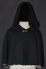 Cloak:2834, Cloak Style:Shaped Shoulder Cloak - Short, Cloak Color:Grey<br>Green embroidery, Fiber / Weave:100% Wool, Cloak Clasp:Alpine Knot - Silvertone, Hood Lining:Unlined, Back Length:20", Neck Length:22", Seasons:Summer, Fall, Spring, Note:"The woods are lovely, dark and deep.<br>But I have promises to keep, and miles<br>to go before I sleep." Robert Frost<br>This embroidered wool cloak<br>will keep you or your child<br>warm on those long walks.<br>A perfect starter cloak lightweight<br>and sized for play and walking<br>100% wool. Dry clean only..