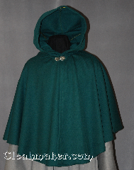 Cloak:2862, Cloak Style:Full Circle Short Cloak, Cloak Color:Green, Fiber / Weave:100% Wool, Cloak Clasp:Vale, Hood Lining:Unlined, Back Length:29", Neck Length:22", Seasons:Spring, Fall, Note:This green cape / short full circle cloak<br>is made of a lightweight wool which allows<br>for a dramatic drape -- perfect<br>for cool evenings. Short enough<br>for a full range of daily activities;<br>it's accented with a silver tone<br>Vale hook-and-eye clasp.<br>Dry Clean only..