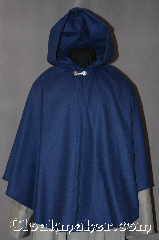 Cloak:2867, Cloak Style:Shaped Shoulder Ruana Cloak, Cloak Color:Navy Blue, Fiber / Weave:100% Wool, Cloak Clasp:Alpine Knot - Silvertone, Hood Lining:Unlined, Back Length:30", Neck Length:19", Seasons:Spring, Fall, Note:This soft navy blue wool Ruana cape<br>is light enough for a fall outing<br>without adding too much bulk.<br>It is versatile for formal or daily use with<br>shortened sides for ease arm movement.<br>Dry clean only..