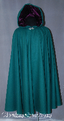 Cloak:2874, Cloak Style:Full Circle Cloak, Cloak Color:Forest Green, Fiber / Weave:100% Wool, Cloak Clasp:Vale, Hood Lining:Purple Velvet, Back Length:45", Neck Length:20.5", Seasons:Fall, Winter, Spring, Note:For a dazzling addition to your wardrobe,<br>try this eye catching color combination. <br>This fun and dramatic 100% wool<br>green cloak is lined with a striking<br>purple hood, and finished off with<br>a silver-tone Vale hook-and-eye clasp.<br>Dry Clean Only..
