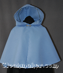Cloak:2875, Cloak Style:Shaped Shoulder Cloak - Short, Cloak Color:Light Blue, Fiber / Weave:80% Wool/20% Nylon, Cloak Clasp:Alpine Knot - Silvertone, Hood Lining:Fleece lined, Back Length:22", Neck Length:17.5", Seasons:Fall, Spring, Note:A beautiful light blue Shaped<br>shoulder Raincloak with some<br>weight for protection from wind.<br>Completely lined with a light<br>fleece for warmth.<br>With a silver tone Alpine Knot<br>hook and eye clasp.<br>Sized for a child or young adult..