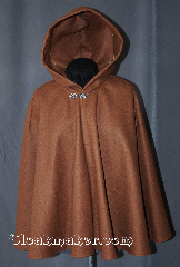Cloak:2917, Cloak Style:Shaped Shoulder Cloak - Short, Cloak Color:Caramel, Fiber / Weave:100% Wool, Cloak Clasp:Antiquity, Hood Lining:Unlined, Back Length:28", Neck Length:20", Seasons:Fall, Spring, Southern Winter, Winter, Note:This caramel short shape<br>shoulder cloak is a great starter<br>cloak or a fashionable alternative<br>to a shawl. Made of 100% wool<br>this cloak is unlined. and accented with a<br>classic antiquity hook-and-eye clasp.<br>Sized for child or young adult.<br>Dry Clean only.