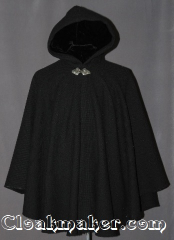 Cloak:2950, Cloak Style:Cape / Ruana, Cloak Color:Black Woven, Fiber / Weave:80% Wool / 20% Nylon, Cloak Clasp:Triple Medallion, Hood Lining:Black Velvet, Back Length:33", Neck Length:20", Seasons:Fall, Spring, Southern Winter, Note:A cross between a cape and a cloak,<br>a ruana is a great way to keep warm<br>while frequent, unhindered use<br>of your arms is needed.<br>Ruanas make great driving cloaks!<br>This gorgeous woven wool blend<br>accented with a triple medallion<br>hook and eye clasp.<br>Dry Clean Only.