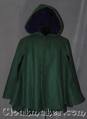 Cloak:3019, Cloak Style:6 Panel Short Cloak<br>with arm holes, Cloak Color:Forest Green, Fiber / Weave:100% Wool, Cloak Clasp:Battle Axes - Silvertone, Hood Lining:Purple Cotton Velveteen, Back Length:33.5" back<br>27" front, Neck Length:20", Seasons:Fall, Spring, Note:This short cloak is a gorgeous<br>forest green with purple cotton<br>velveteen hood lining.<br>Made of mid-weight wool<br>with arm holes allowing for<br>a wide range of movement.<br>Perfect for driving on cold days.<br>Accented with a Silver tone<br>Battle Axe hook-and-eye clasp.<br>Dry Clean only..