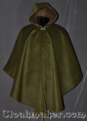 Cloak:3021, Cloak Style:Shaped Shoulder Ruana Cloak, Cloak Color:Mossy Green, Fiber / Weave:100% Polyester<br>Suede outer finish, brushed inner surface, Cloak Clasp:Vale, Hood Lining:Self-lined Brown, Back Length:38" back<br>28.5" overarm, Neck Length:21", Seasons:Winter, Southern Winter, Fall, Note:Soft and velvety outside and<br>ideal for a cold evenings.<br>This warm mossy green<br>Shape shoulder ruana<br>is self lined in brown fleece<br>with a silver tone vale<br>hook and eye clasp.<br>A cross between a cape<br>and a cloak, a ruana is a<br>great way to keep warm while<br>requent, unhindered use<br>of your arms is needed.<br>Ruanas make great driving cloaks!<br>Machine washable.