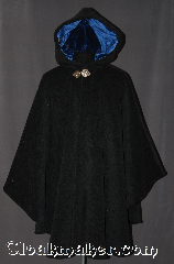 Cloak:3027, Cloak Style:Cape / Ruana extra long<br>over the shoulder, Cloak Color:Grey, Fiber / Weave:Plush 100% Wool Melton<br>with herringbone Pattern, Cloak Clasp:Geranium Leaves<br>Medium Silvertone, Hood Lining:Blue Cotton Velvet, Back Length:41" back<br>29" overarm, Neck Length:20", Seasons:Winter, Southern Winter, Fall, Spring, Note:A cross between a cape and a cloak,<br>a ruana is a great way to keep warm<br>while frequent, unhindered use of<br>your arms is needed.<br>Ruanas make great driving cloaks!<br>This gorgeous plush wool melton<br>with herringbone pattern with a<br>lovely Scottish Irish look.<br>Accented by a blue cotton<br>velvet lining and silver tone<br>geranium hook and eye clasp.<br>Dry Clean Only.