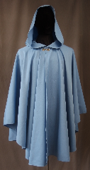 Cloak:3034, Cloak Style:Ruana, Cloak Color:Light Blue, Fiber / Weave:80% Wool / 20% Gabardine, Cloak Clasp:Stina Pewter, Hood Lining:Unlined, Back Length:36", Neck Length:19.5", Seasons:Fall, Spring, Note:A cross between a cape and a cloak,<br>a ruana is a great way to keep warm<br>while frequent, unhindered use<br>of your arms is needed.<br>This light blue wool gabardine ruana<br>is lightweight and has a dramatic<br>swoosh/drape perfect for<br>indoor and outdoor events<br> Accented with a silver tone stina<br>hook-and-eye clasp.<br>Sized for petite adults,<br>Dry Clean only..