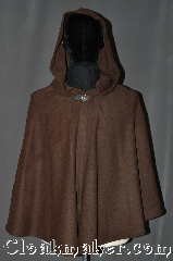 Cloak:3045, Cloak Style:Shaped Shoulder Cloak - Short, Cloak Color:Olive Brown, Fiber / Weave:80% Wool / 20% Nylon, Cloak Clasp:Vale, Hood Lining:Unlined, Back Length:29.5", Neck Length:21", Seasons:Fall, Spring, Southern Winter, Note:This olive brown short<br>shape shoulder cloak<br>is a great starter cloak<br>or a fashionable<br>alternative to a shawl.<br>Made of a wool blend<br> this cloak is unlined.<br>Accented with a<br>silver tone vale<br>hook-and-eye clasp.<br>Dry Clean only..