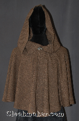Cloak:3078, Cloak Style:Ruana short lirapipe, Cloak Color:Tan and black weave, Fiber / Weave:Tropical Weight Wool Poly Blend, Cloak Clasp:Vale, Hood Lining:Unlined, with 37" lirapipe, Back Length:26", Neck Length:20", Seasons:Fall, Spring, Note:A one of a kind short ruana cloak<br>with a lirapipe hood.<br>Perfect for a dramatic<br>entrance and practical.<br>You can use your hood as<br>a scarf or pocket.<br>Made from a woven wool poly<br>of tan and black and adorned with a<br>hook and eye vale clasp.<br>Hand wash tropical weight.