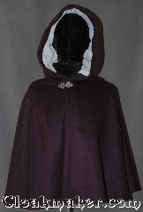 Cloak:3096, Cloak Style:Shaped Shoulder<br>Short Cloak, Cloak Color:Purple, Fiber / Weave:Wool, Cloak Clasp:Vale, Hood Lining:Light Blue Moleskin, Back Length:24", Neck Length:21", Seasons:Fall, Spring, Southern Winter, Note:A wonderful starter cloak for a<br> child or adult.<br>Bright and colorful sized for<br>play and walking.<br>With shaped shoulders for<br>a more secure fit.<br>Dry clean only..