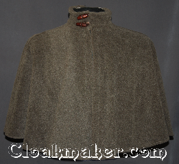 Cloak:3163, Cloak Style:Shaped Shoulder Short with Collar, Cloak Color:Aged Walnut grey / latte, Fiber / Weave:Windblock Polar fleece, Cloak Clasp:2 Wooden toggles, Hood Lining:N/A<br>Doubled sided fabric with<br> tan inside, Back Length:21", Neck Length:20.5", Seasons:Fall, Spring, Southern Winter, Winter, Note:A one of a kind shape shoulder cloak<br>made of a two tone discontinued<br>wind-block polar fleece.<br>The outer  walnut grey has a<br>classic versatile shade with<br>the pop of tan/ latte  underneath.<br>The mandarin collar and wooden toggles<br>pull together the earthy feel<br>of this wonderful cloak.<br>Can not be reproduced..