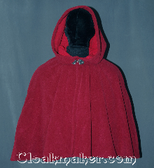 Cloak:3172, Cloak Style:Shaped Shoulder Cloak - Short, Cloak Color:Raspberry Red / Cherry Red, Fiber / Weave:Windblock Polar Fleece, Cloak Clasp:Triple Medallion, Hood Lining:N/A<br>Two tone fabric with<br>red interior raspberry exterior, Back Length:25", Neck Length:19", Seasons:Winter, Southern Winter, Fall, Spring, Note:A one of a kind shape shoulder cloak<br>made from the warmest fabric you<br>can find. Designed to block cold<br>winter winds and resist water.<br>This fleece is two tone discontinued<br>color combination of raspberry<br>on the outside and cherry on the inside<br>for that added pop of color.<br>Machine washable NEVER DRY CLEAN..