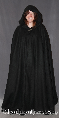 Cloak:3183, Cloak Style:Full Circle Cloak, Cloak Color:Black, Fiber / Weave:Fleece, Cloak Clasp:Vale, Hood Lining:Unlined, Back Length:54", Neck Length:25", Seasons:Fall, Spring, Note:Lightweight black economy fleece<br>provides a warmth with very little weight.<br>Suitable for indoor wear late spring,<br>early fall, cool summer evenings<br>or just snuggling on the couch. Machine washable..